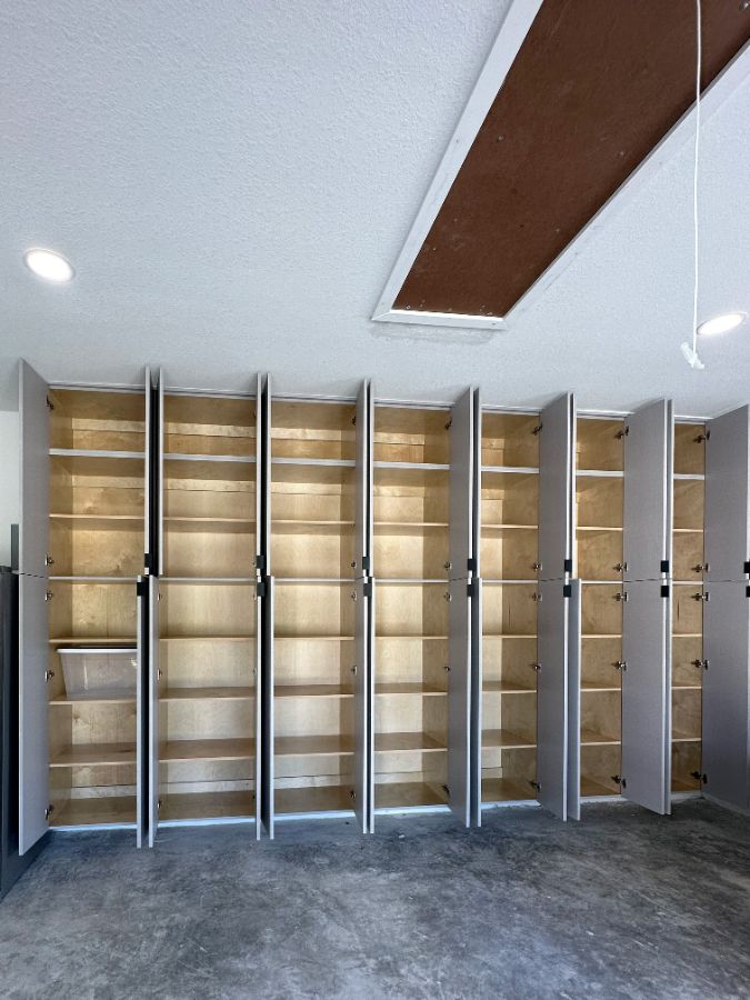 Open garage cabinets with shelves