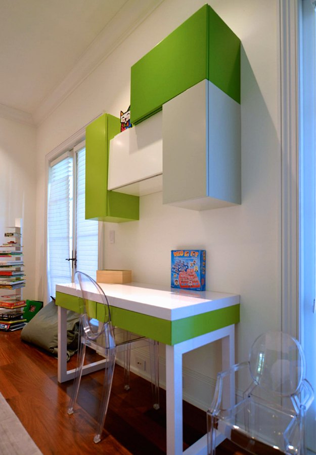White and green desk with green and white wall cabinets