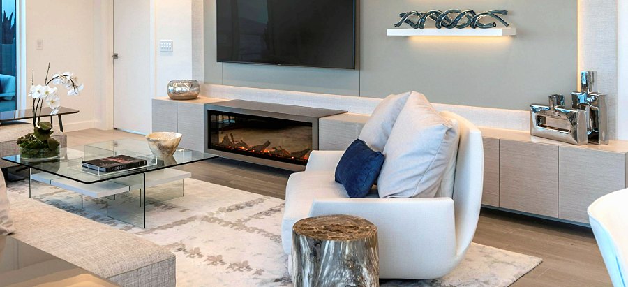 TV unit with integrated fireplace and wall panel with lit shelves